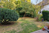 Wohnen mit Garten in HD-Südstadt: 3 ZKB Erdgeschosswohnung mit Terrasse und ca. 200 m² Grün - Gartenansicht (KI generiert)